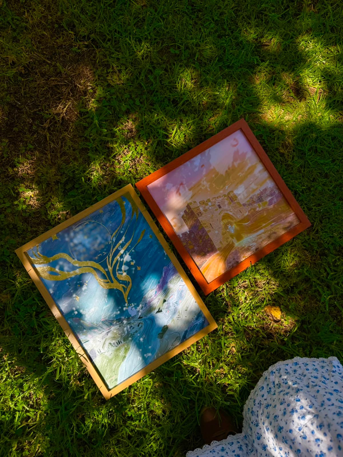The Soul Descends shown alongside another piece from the series on grass