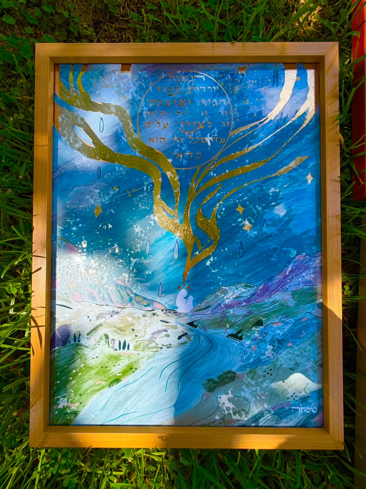 The Soul Descends framed artwork laid on grass